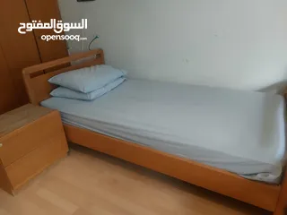  3 A single bed with 2 side tables for sale. Used but in good condition. سرير مفرد مع فرشة + خزانة جنب