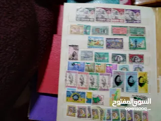  11 نيشان ملكى وزن41, 41 جرام من الدهب والفضه وعقدفضه من الاحجار الكريمه وطوابع قديمه نادره