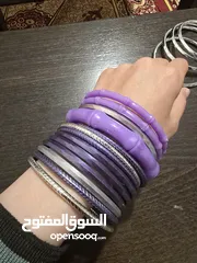  16 اساور بلاستيك بنفسجي، وفضي عدد 15