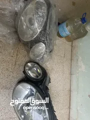  2 اضوية مرسيدس -e200 زينون بحالة الوكالة 2003-2006