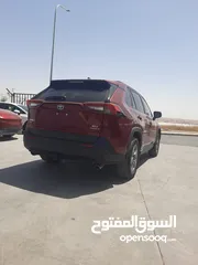  6 تويوتا راف فور XLE موديل 2022 لون خمري داخل جلد اسود عداد قليل