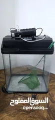  1 Fish Tank with water filter Used and Clean. Filter working condition..