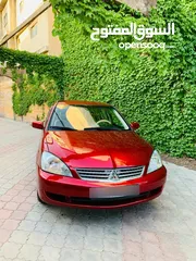 4 ميتسوبيشي لانسر 2009 بحالة الشركه 1600cc لون خمري للبيع