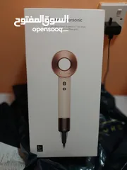  1 Dyson Supersonic hair dryer in Ceramic pink and rose gold.