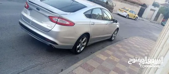  15 فورد فيوجن 2014 هايبرد كلين فحص كامل لون سلفر بحالة الوكالة