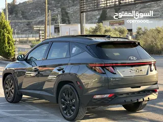  9 هونداي توسان هايبرد  بلاك ايديشن كامل الاضفات لون مميز  سنة الصنع 2022
