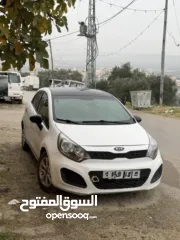  2 كيا ريو 2012 تأمين شامل سنة كاملة  السيارة نظيفة ماطور جير الالف الالف لون ابيض مع سقف اسود اندماج