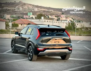  9 كايا نيرو  هايبرد (بنزين+كهرباء ) فل الفل فتحة سقف  /2022 عداد قليل 18000Km