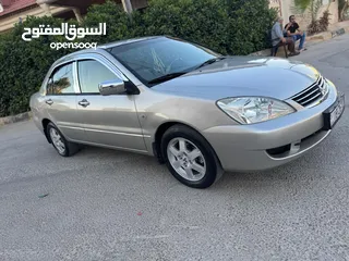  1 ميتسوبيشي لانسر فحص كامل 1600اصلي ولا ملاحظه موديل 2009 اوتوماتيك بوضع الشركه وارد الكويت مالك واحد