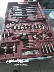  6 جهاز فحص سيارات  كومبيوتر وجهاز تنظيف بخاخات