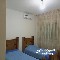  13 شقة مفروشة أرضية للايجار في ضاحية الرشيد 4 مكيفات بكل غرفة مكيف وبئر ماء خاص للشقة