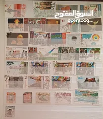  11 طوابع من جميع دول العالم بنص دينار فقط