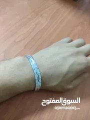  3 Stainless steel bracelet with starburst engraving. سوار ستانلس ستيل مع نقش متكرر لإنفجار نجمي