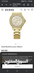  7 ساعة guess ذهبية اللون