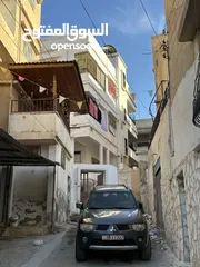  2 شقتين للبيع (أرضي + تسوية)  الزرقاء حي رمزي في منطقة حيوية جداً