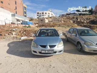 1 لانسر 2005 وارد الكويت 4 جيد ماتور 1600 الاصلي "الملا"