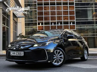  5 تويوتا كورولا هايبرد فحص كامل وارد المركزية وصيانة المركزية لون اسود مميز بحالة جيدة جدا كوشوك جديد
