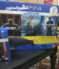  1 PS4 slim with 2 controllers and 5 games with box