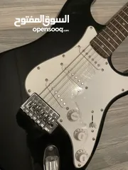  2 Electric guitar(Black and white) and Amplifier.  غيتار كهربائي(اسود و ابيض) و مكبر للصوت