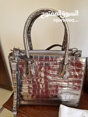  1 Like new Michael Kors crossbody bag metallic colour
