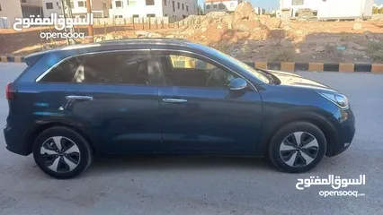  21 كيا نيرو لون كحلي فحص 2 جيد بسعر مغري قابل للبدل