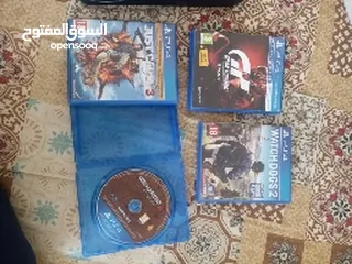  2 ps4 with 2 controllers and 4 games