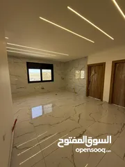 21 شقه طابق ارضي 144متر مع ترس 30 متر للبيع في جبيهه حي المنصور بموقع مميز