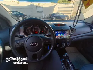  7 كيا فورتي 2011 فحص 2 جيد امامي كراسي مدفية،كوندشن،تحكم طارة،مري كهرباء كاميرا خلفية وشاشة نظام خرائط