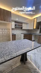  13 شقه طابقيه اربع غرف نوم الزرقاءالجديده شارع الونك  خلف فندق الجوابره مع مطبخ للبيع