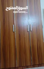  2 wooden 3 door cupboard