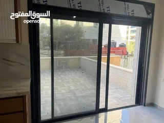  2 شقه للبيع في عين منجد مع حديقه