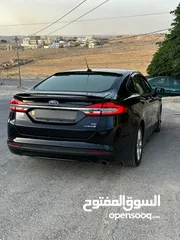  21 فورد فيوجن هايبرد 2017 للبيع وارد أمريكي فل كامل ما عدا الفتحه فحص 7 جيد كلين تايتل
