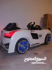  1 TOW SEATER KIDS CAR , RECHARGEABLE.