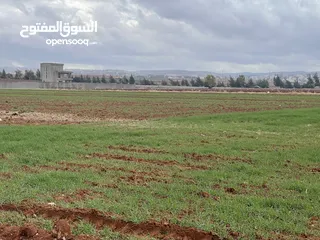  9 للبيع ارض اربد الحصن قرب جسر النعيمة وخلف معارض شهوان وطريق عمان الدولي قوشان مستقل حوض البطام
