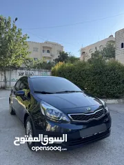  3 كيا ريو 2014 متور 1250 بنزين جير عادي فحص ممتاز  لون كحلي فرش بيج تحكم ستيرنج
