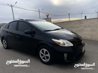  7 تويوتا بريوس 2015 هايبرد فل كامل مع بانوراما أعلى صنف بكج ( 5) لون اسود مميز