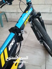  11 دراجة هوائية من نوع SPORTS INC من طراز SHIMANO جنط 26 باللون الأزرق اقرأ الوصف بدقة قابل للتفاوض
