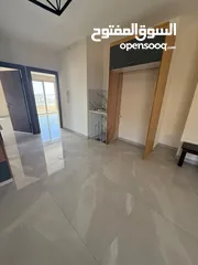  2 شقه غير مفروشه للايجار في عين مجد قرب مطعم تغميسه