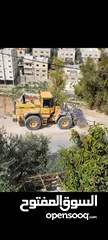  9 تعهدات عامة وهدم مباني ونقل جميع أنواع مواد البناء ونقل تراب أحمر وتعبيد الشوارع بأفضل أنواع الخلطة