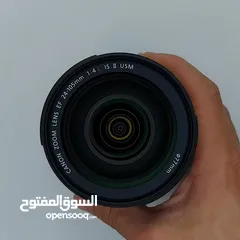  9 للبيع عدسة 105-24 canon الأصدار الثاني الخط الأحمر، نظيفة جدا+ هود للعدسة مجانا