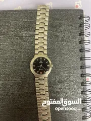  1 espec ساعة فضية كوارتز ستانلس ستيل ضد الماء صنع في الصين سير على شكل صدفات بحرية الداخل أسود