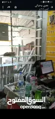  14 رفوف خشب وزجاج وسوبرماركت وقرمه ولوحة اعلانات و معرش زينكو وأبواب سيكريت مظله وألواح خشب تعليق وشبك