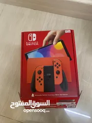  2 Nintendo switched OLED Super Mario edition with Super mario Odyssey