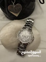  5 ساعه guess اصليه لون فضي