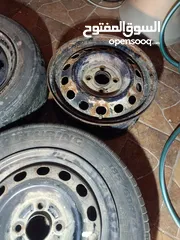  4 جنط لانسر حديد 14 برغي بعيد عدد 3