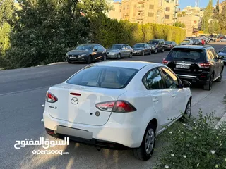  9 مازدا زوم 2 موديل 2012 فحص كامل 7 جيد ولا ملاحظة لون ابيض قاطعة مسافة 100 الف كيلو فقط (استخدام شخصي