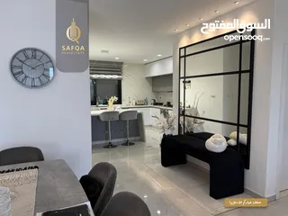  4 شقة مميزة جداً واسعة بتشطيب حديث للبيع في عين منجد في عمارة عصرية راقية