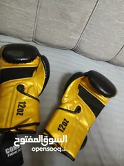  2 قفازات ملاكمه اصليه مع باندج