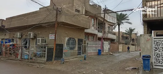  7 للبيع في بغداد الجديدة 50متر فيها ثلاث محلات مؤجرة بناء مسلح 2012على شارع عريض ركن