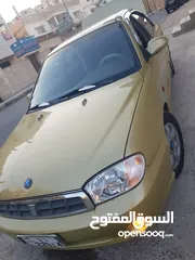  5 كيا سبكتر توماتيك اقساط دفعة 1200 دهان جديد  ماتور جديد  قير جيد  فحص مرفق  مكانيك سيارة مشية ناعمة